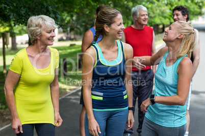 Marathon female athletes laughing together