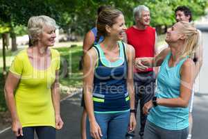 Marathon female athletes laughing together