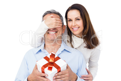 Pretty couple offering present to husband