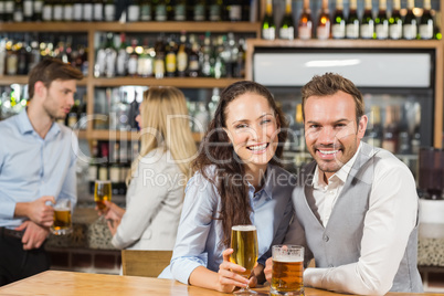 Couples holding beer