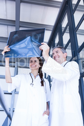 Doctors examining a x report