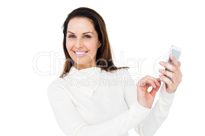 Smiling woman using smartphone