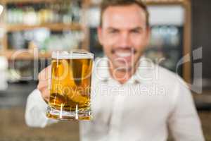 Handsome man toasting