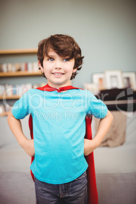 Smiling boy wearing superhero costume