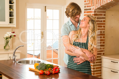 Cute couple hugging with arms around