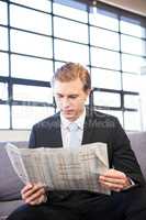 Businessman reading a newspaper