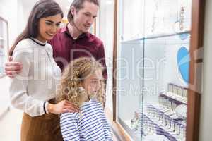 Happy family shopping in jeweler shop