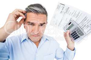 Worried man calculating tax