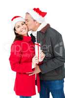 Festive couple exchanging christmas gift