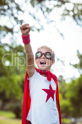 Little boy pretending to be superhero