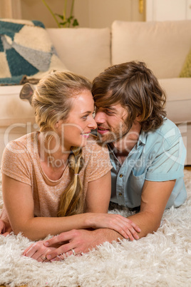 Cute couple lying on the carpet