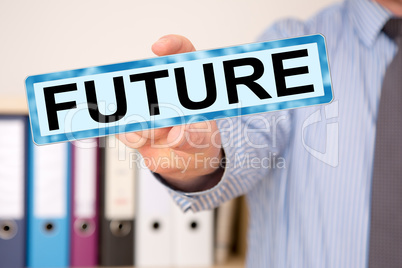 Businessman holding sign with inscription, FUTURE