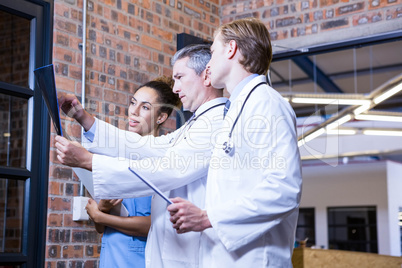 Medical team examining a x report