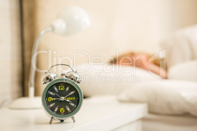 Pretty woman sleeping with alarm clock view Pretty woman sleeping with alarm clock view