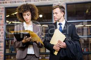 Lawyer and businesswoman looking at documents