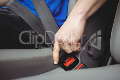 Man buckling his seatbelt