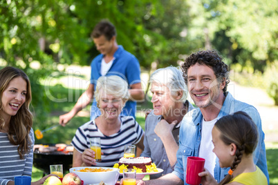 Family and friends having a picnic with barbecue