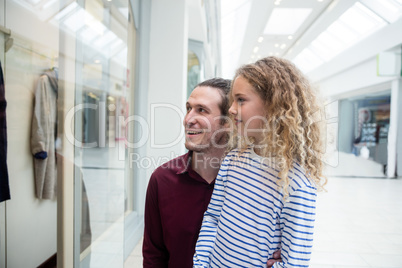 Happy father and daughter in shopping mall