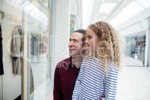 Happy father and daughter in shopping mall