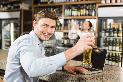 Man toasting a beer