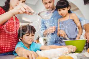 Family preparing food at home