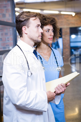 Doctor and nurse with medical report