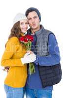 Happy couple holding a flower bouquet