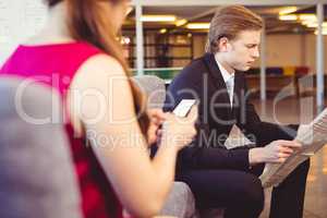 Businessman reading a newspaper