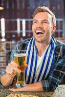 Man toasting a beer