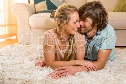 Cute couple lying on the carpet