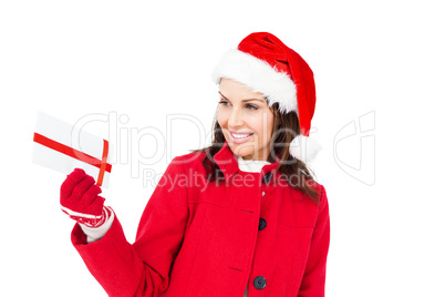 Beautiful brunette holding a christmas gift