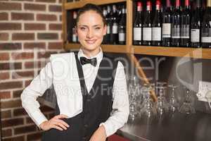 Barmaid smiling at camera