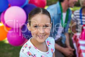 Smiling little girl at birthday party