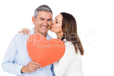 Lovely couple holding big heart