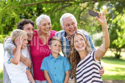 Smiling family taking selfie