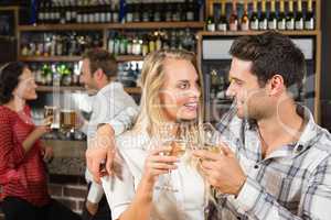 Couple looking at each other and toasting