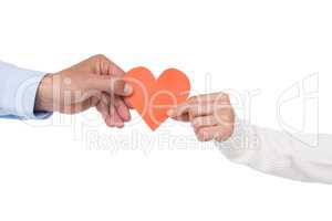 Couple holding paper heart