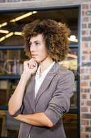 Businesswoman with hand on chin