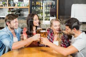 Friends toasting with beers