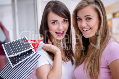 Portrait of beautiful women with shopping bags