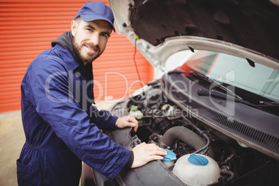 Mechanic fixing a van