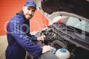 Mechanic fixing a van