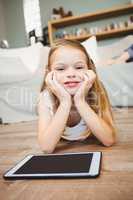 Portrait of smiling girl with digital tablet