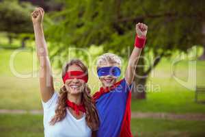 Mother and son pretending to be superhero