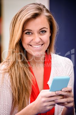 Portrait of beautiful woman using mobile phone