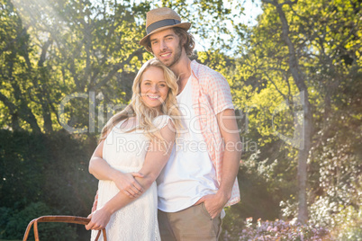 Happy couple having a picnic and embracing