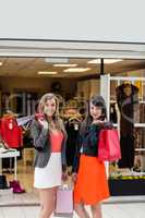 Beautiful women standing in front of garment shop