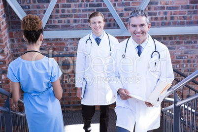 Doctors walking on staircase