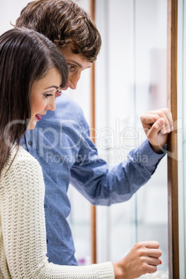 Happy couple shopping in mall