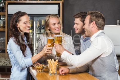 Friends toasting with beers